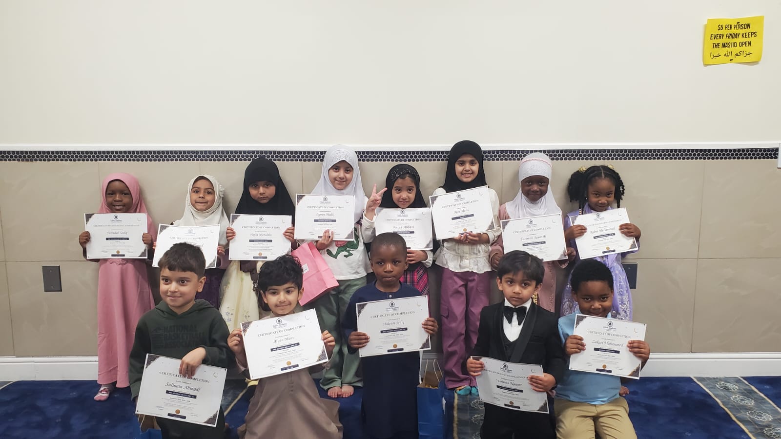 Falah Academy graduates with completion certificates